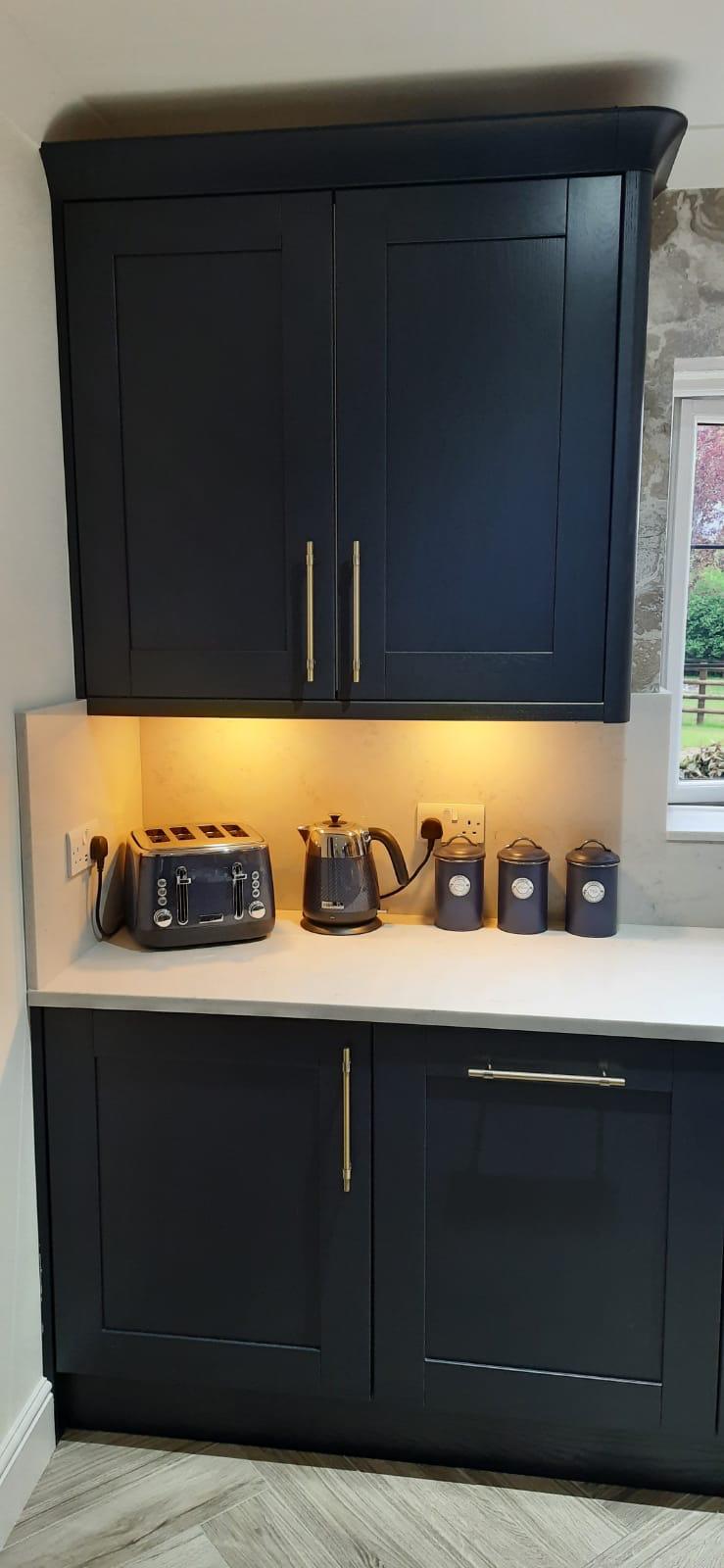 Navy shaker corner with appliance shelf and canisters
