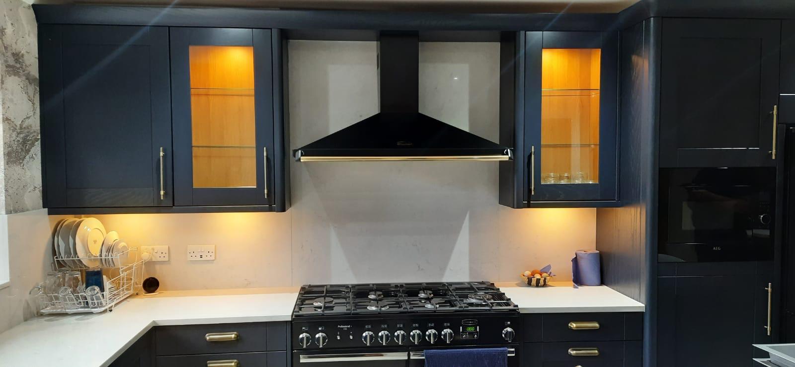 Navy kitchen with range cooker and chimney hood