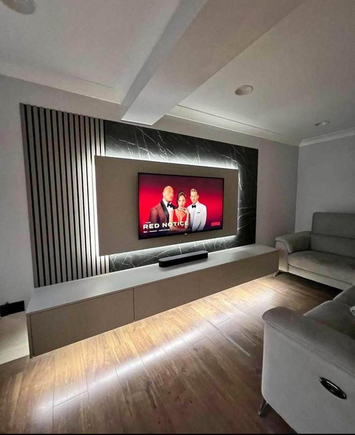 Marble-backed media wall with slat detail